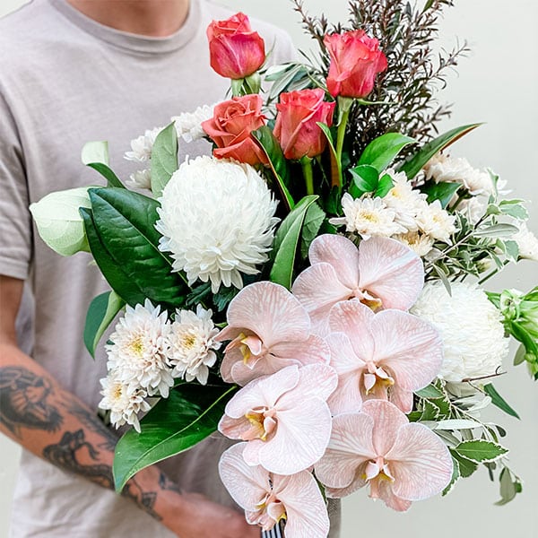 Pretty Flower Bouquet Holding By A guy — Florist in Birtinya, QLD