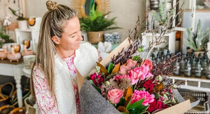 Florist Creating Flower Bouquet — Florist in Birtinya, QLD
