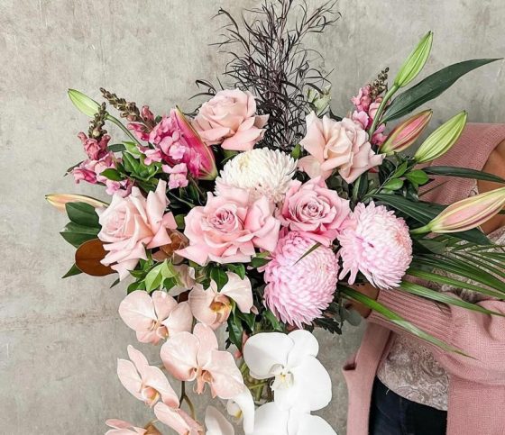 Woman Holding A Bouquet Of Flowers